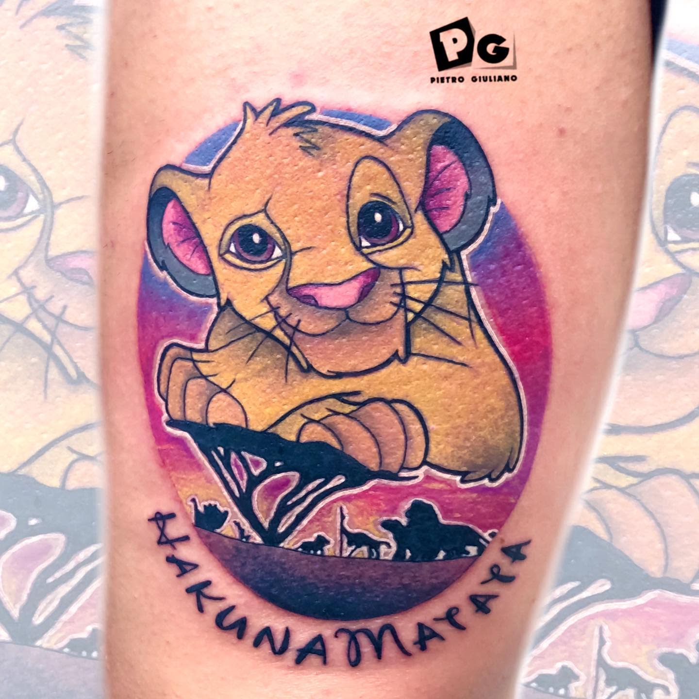 Tattoo of young Simba with "Hakuna Matata" text and Pride Rock in the background